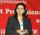 Suneeta giving a talk to the members of CII